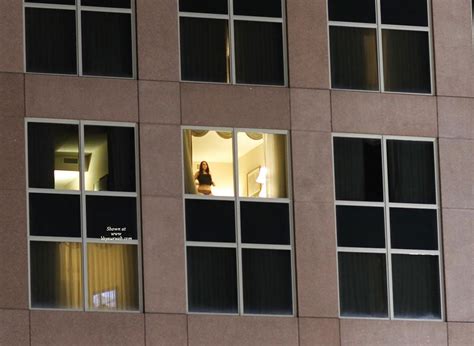 naked in a window